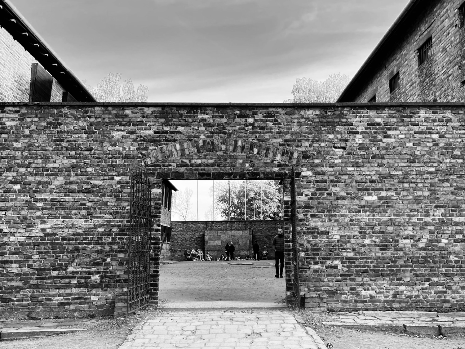 a brick wall with a gate