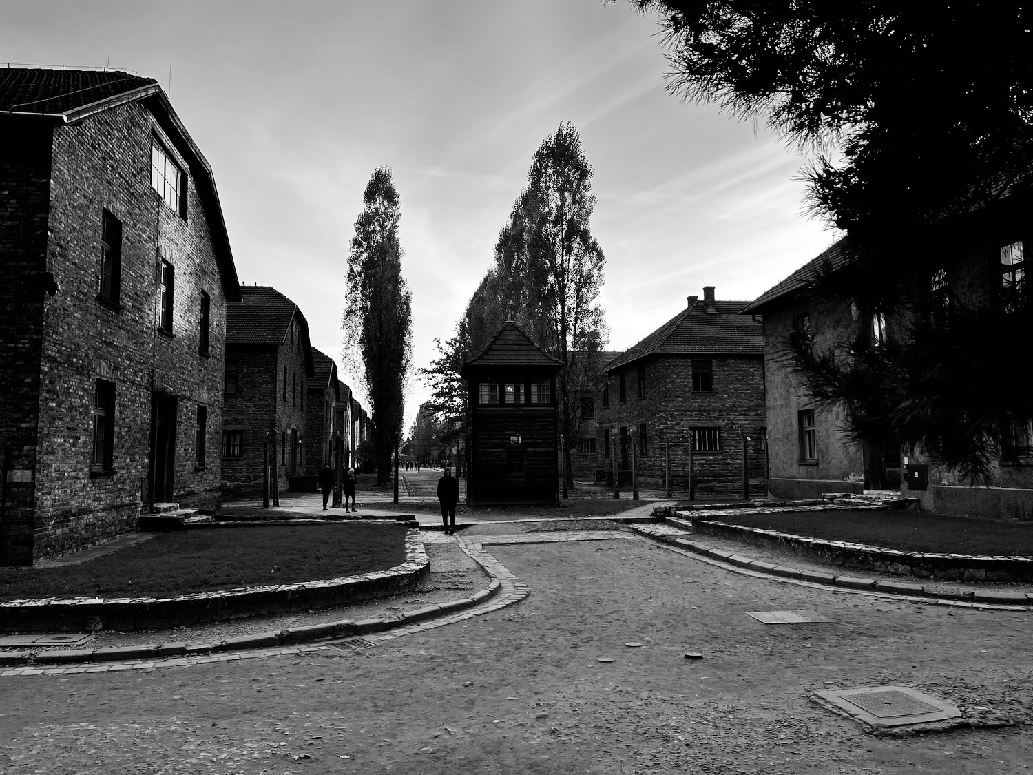 a group of people walking in a courtyard