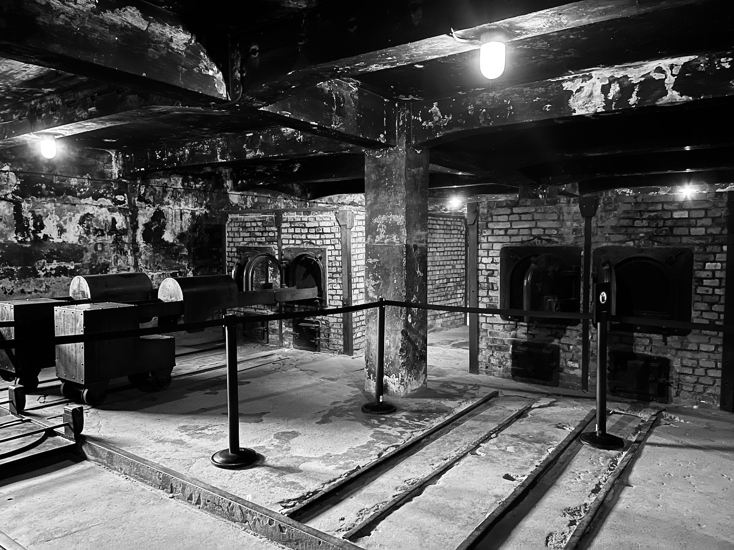 a black and white photo of a brick room