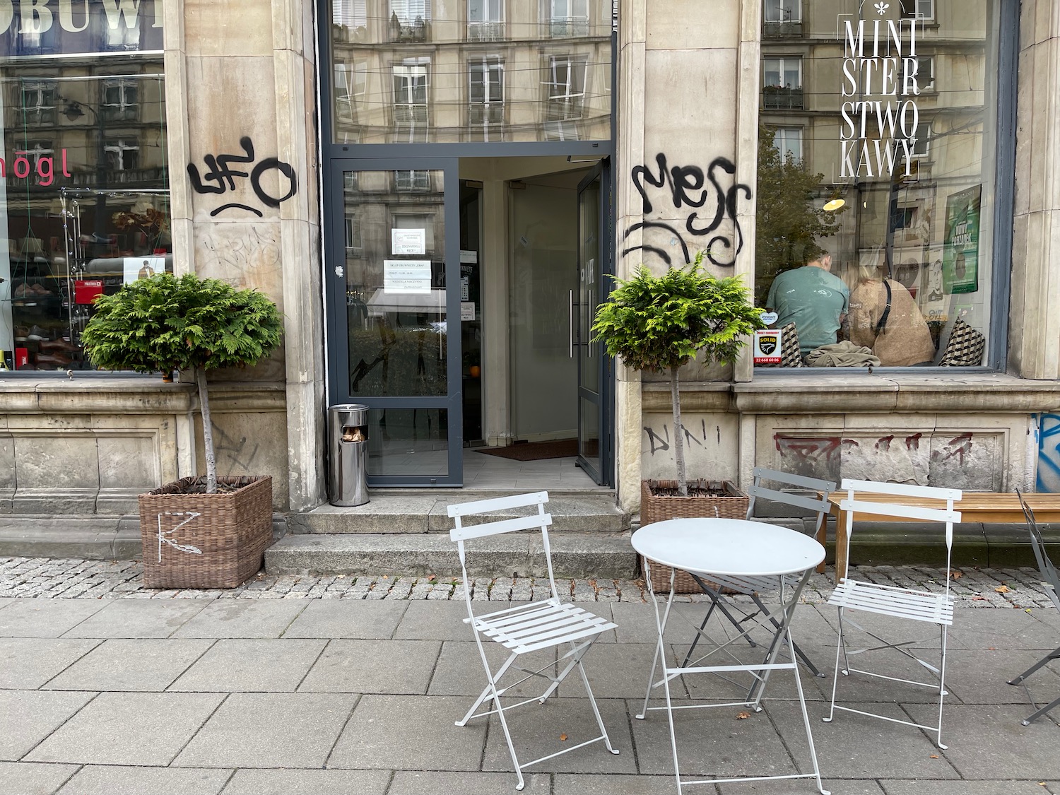 a table and chairs outside a building