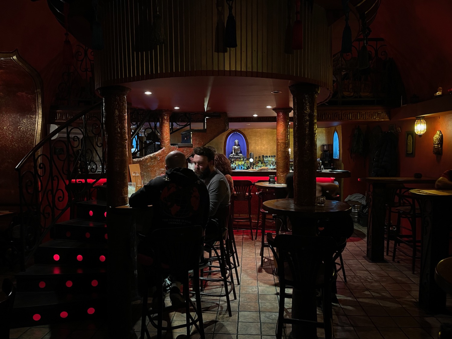 a group of people sitting at a bar