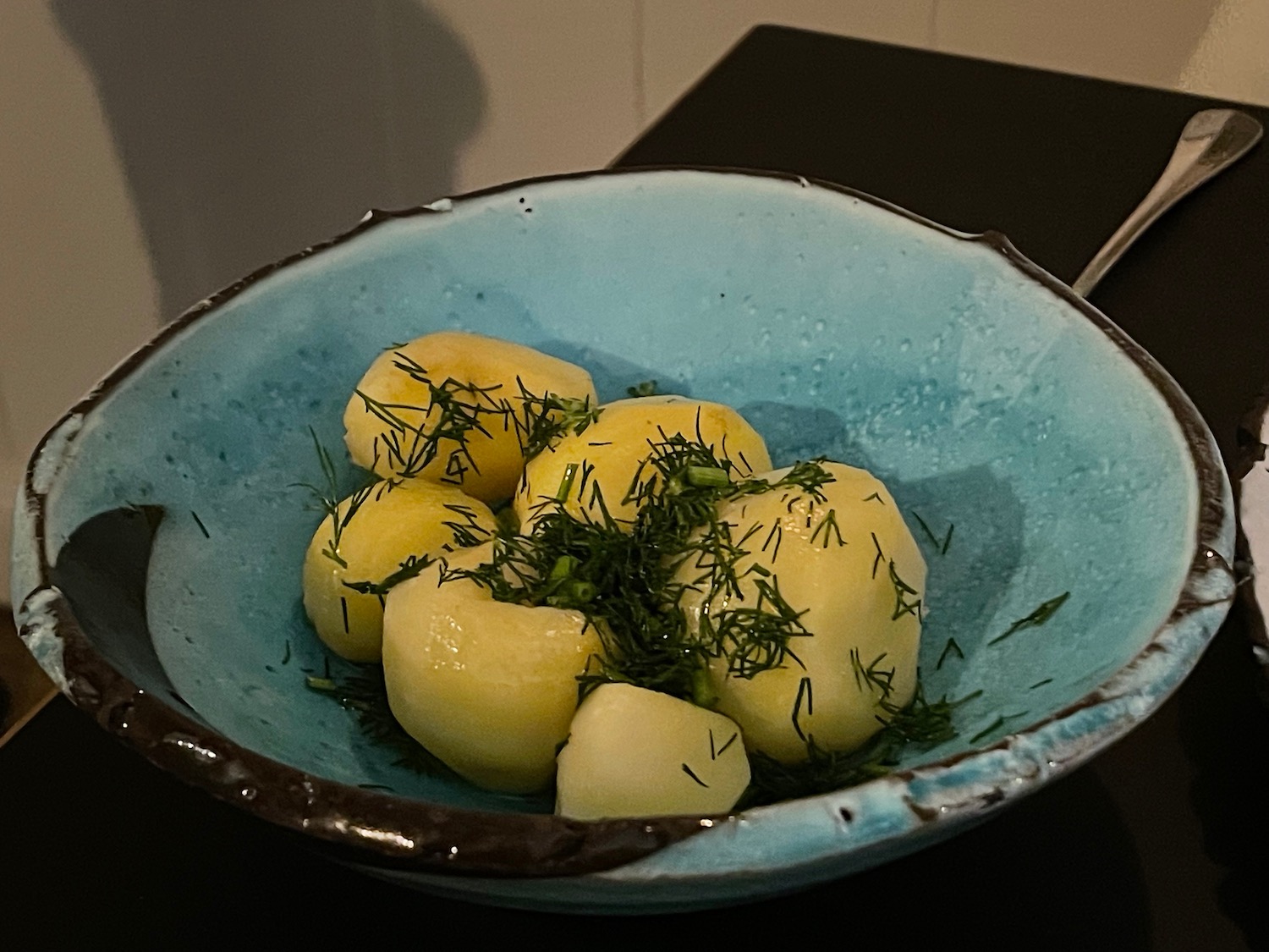 a bowl of food with green leaves