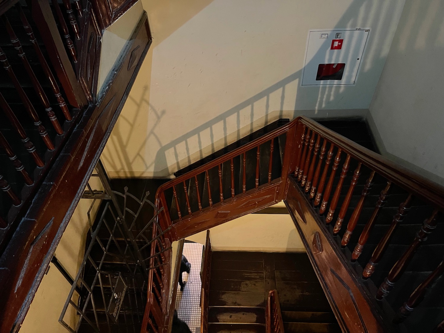 a staircase with a person standing on the floor