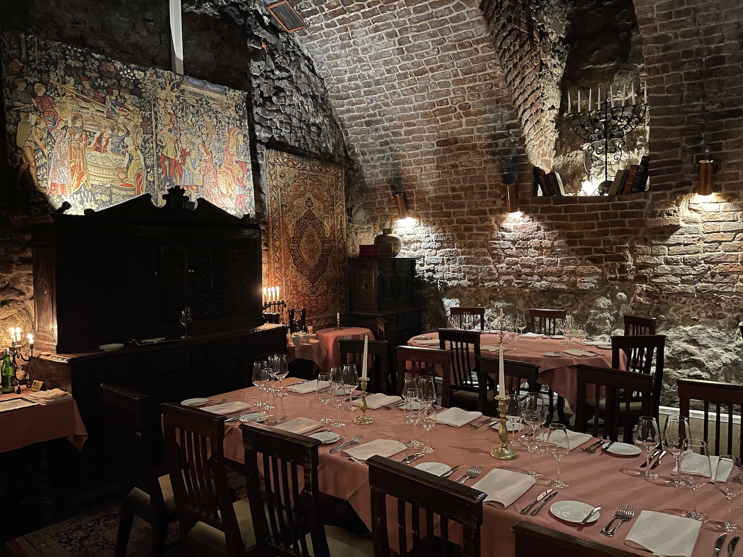 a room with a table set for a dinner