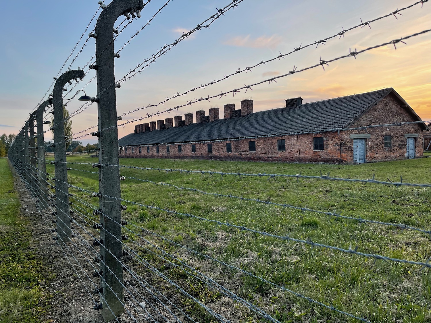 a building with barbed wire fence