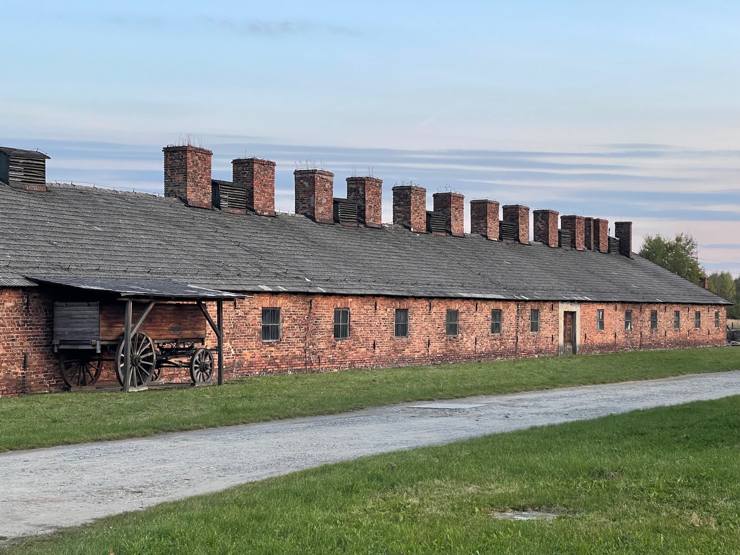 a brick building with a wagon on the side