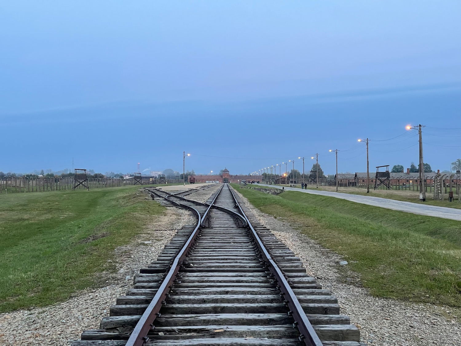train tracks leading to a building