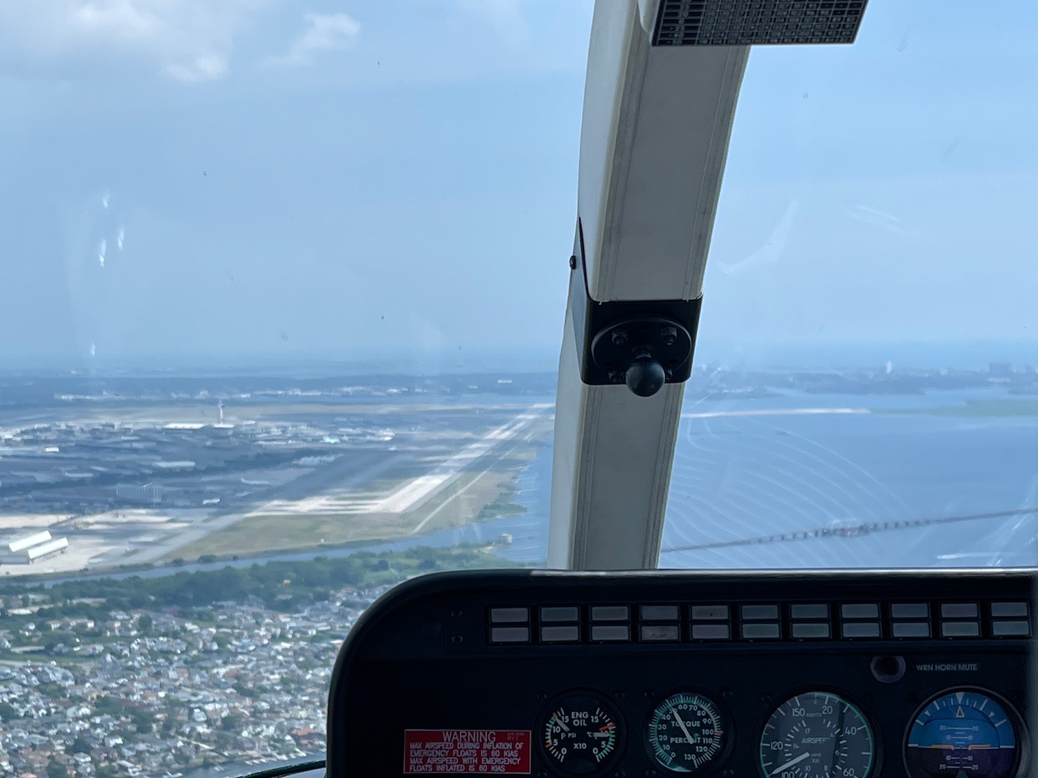 a view of a city from a cockpit of a plane