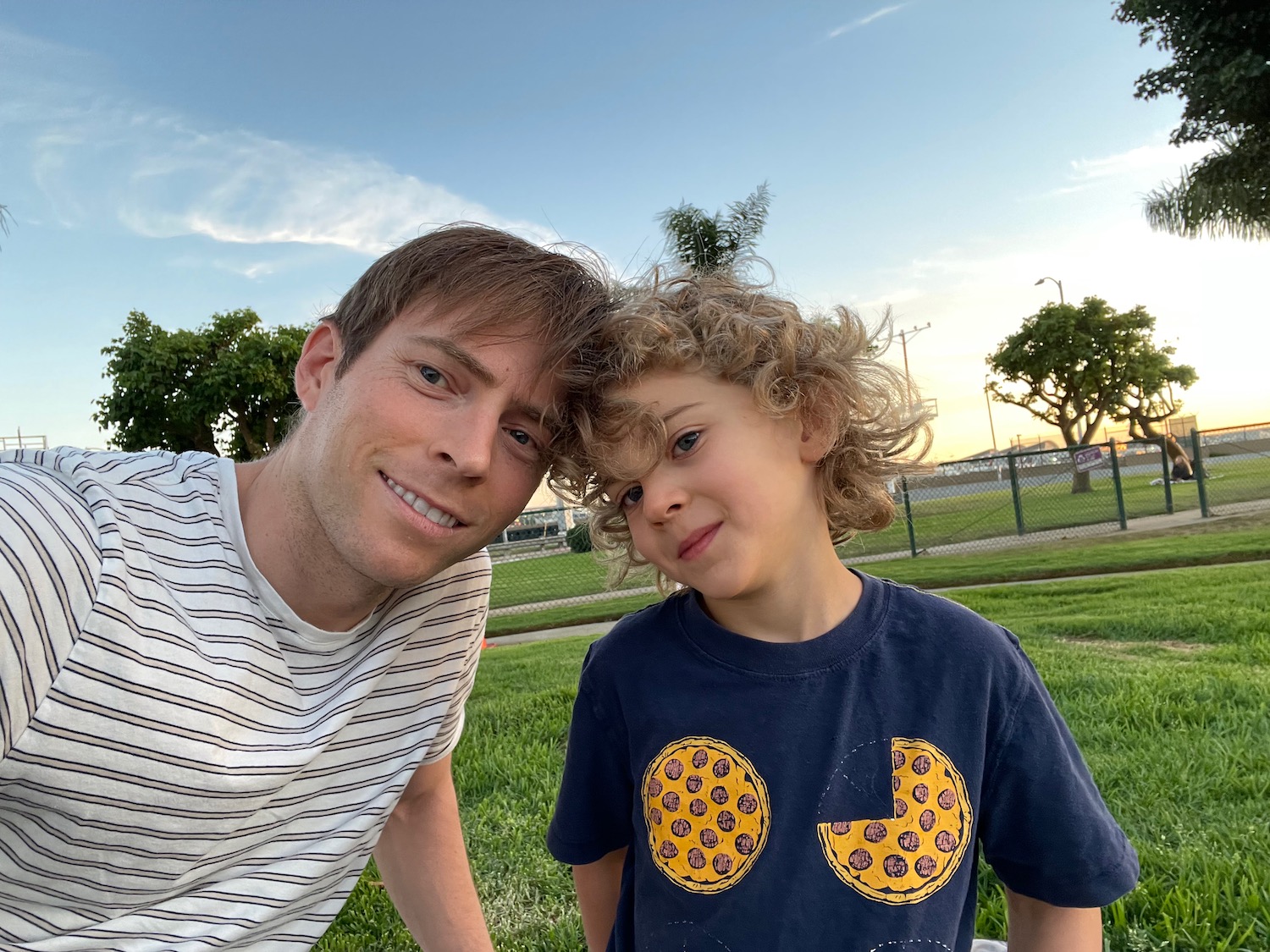 a man and boy posing for a picture