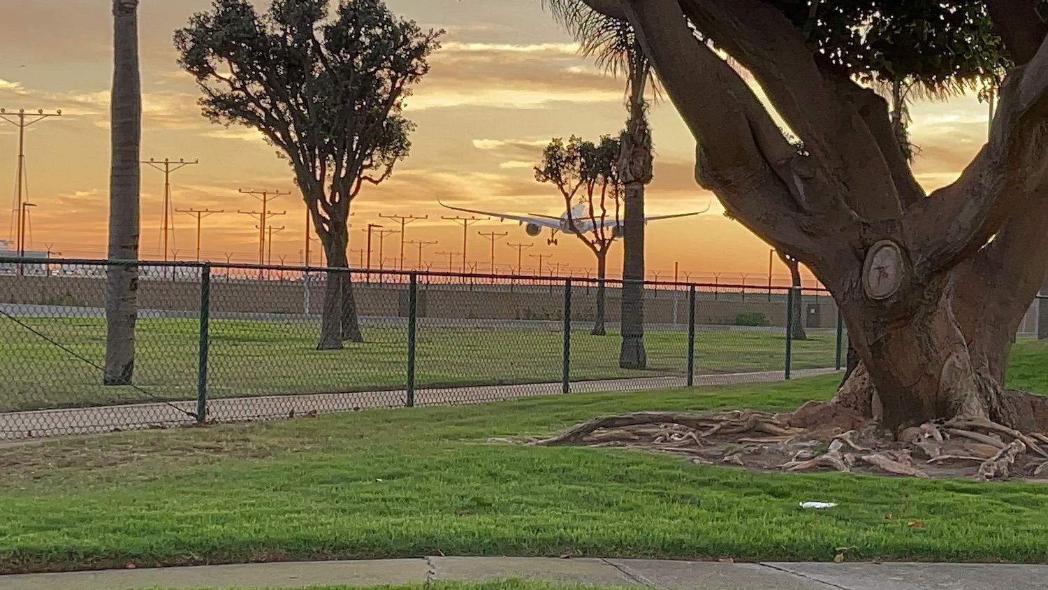 an airplane flying over a field