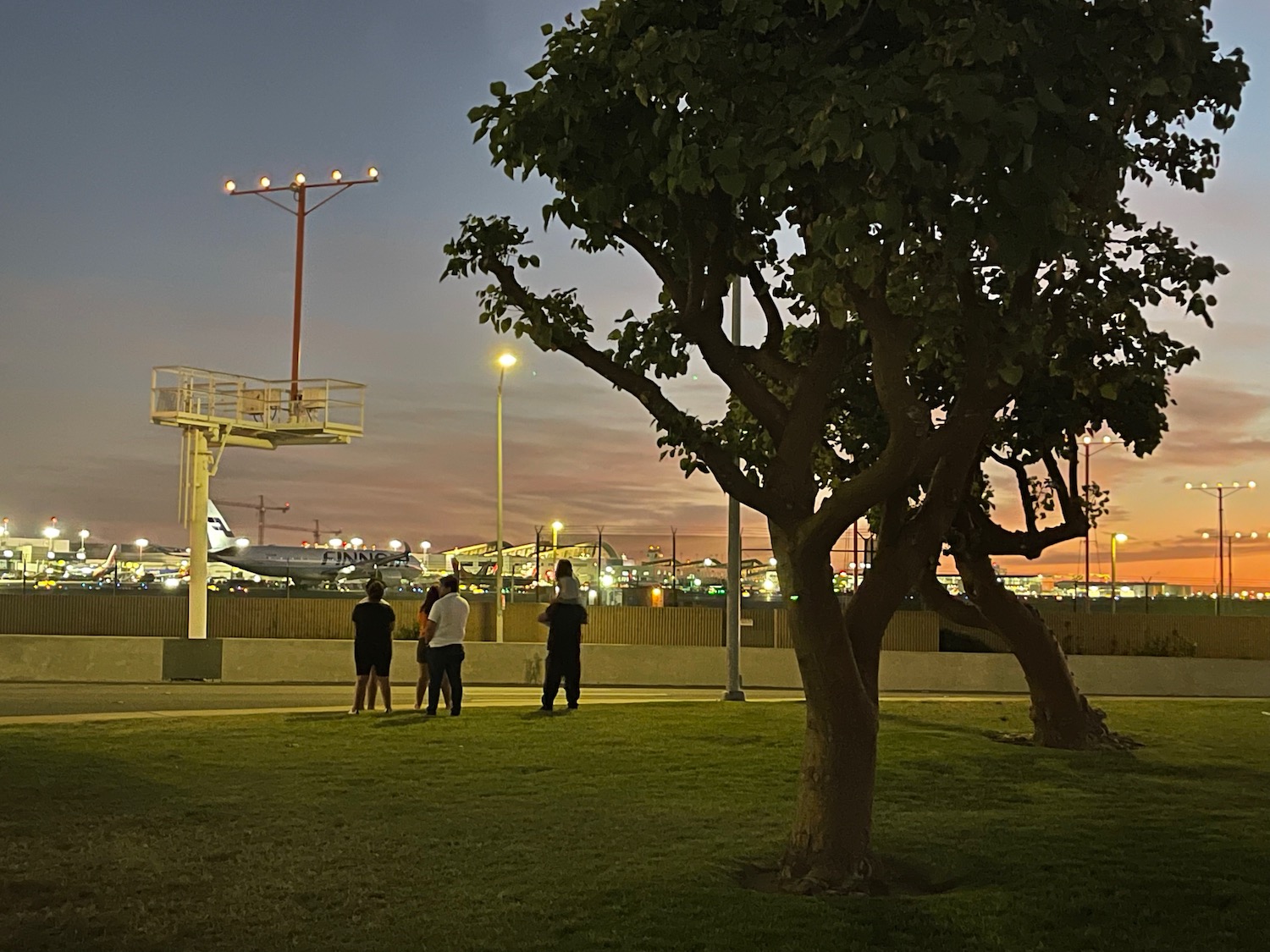 a group of people standing in a park