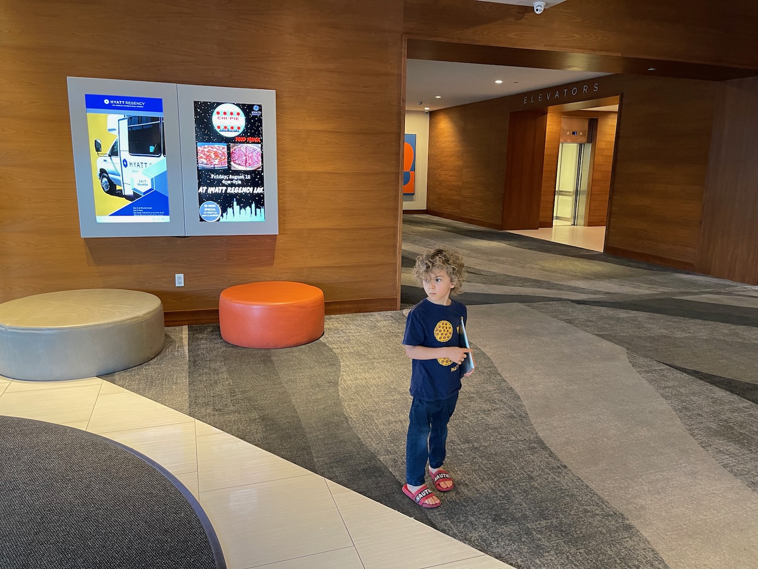 a child standing in a lobby