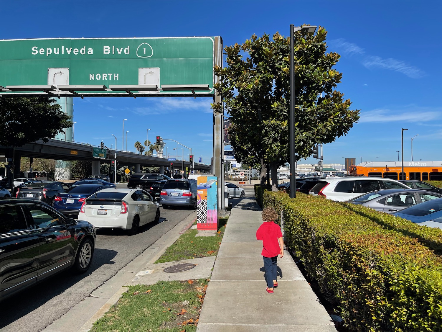 a child walking on a sidewalk