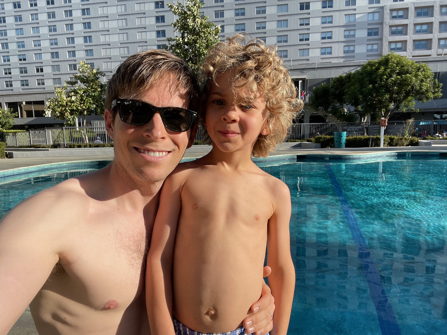 a man and boy in a pool