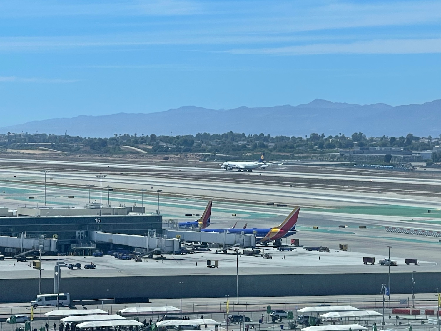 an airport with airplanes on the runway