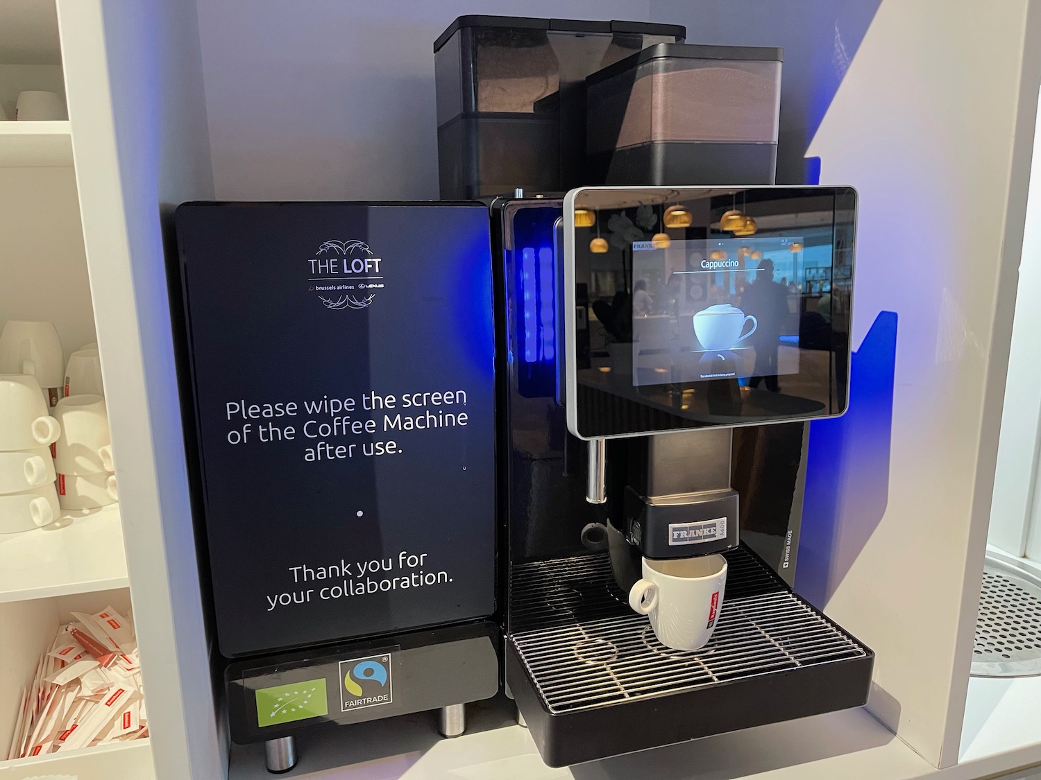 a coffee machine with a screen on it