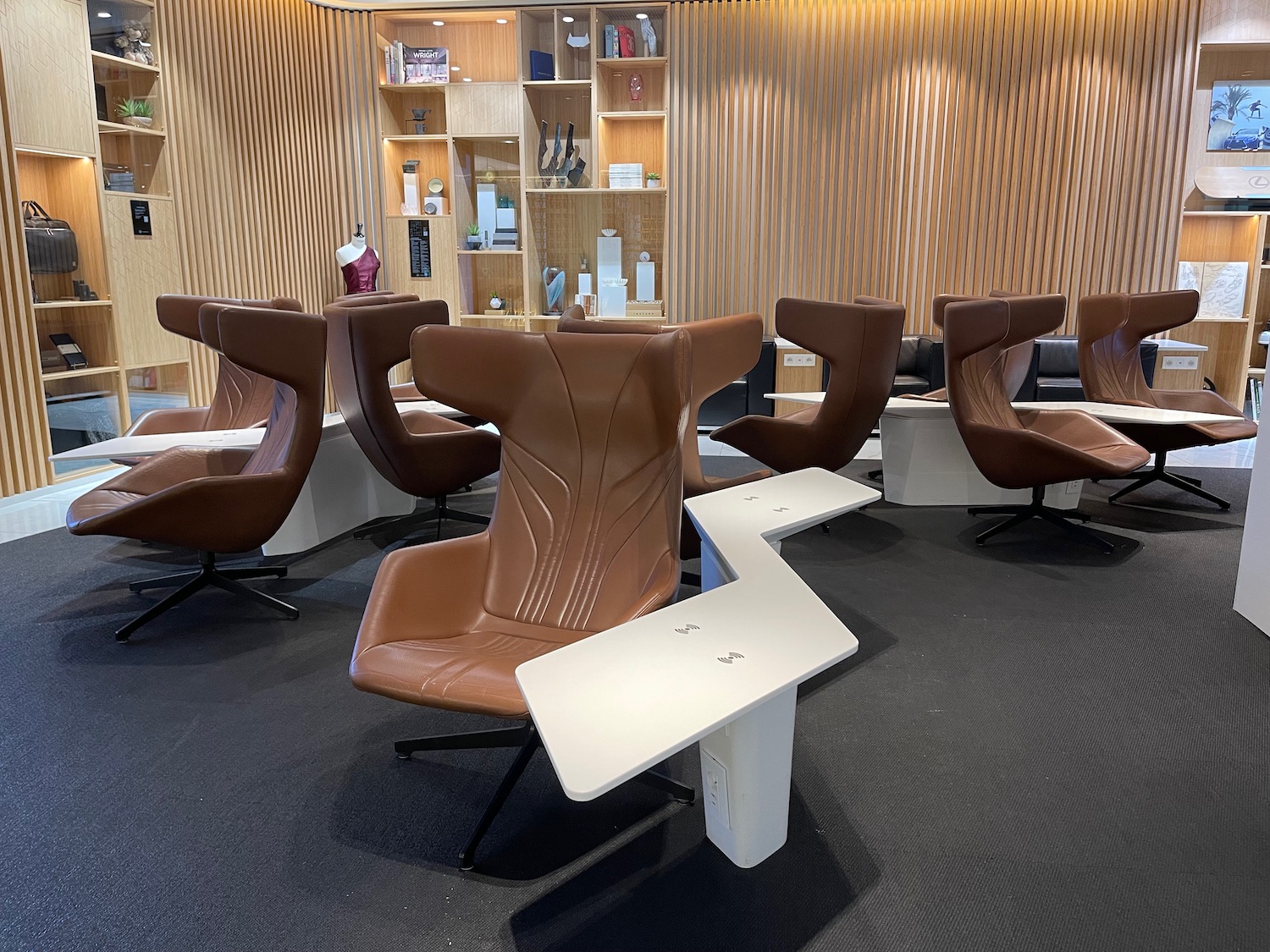 a room with brown chairs and tables