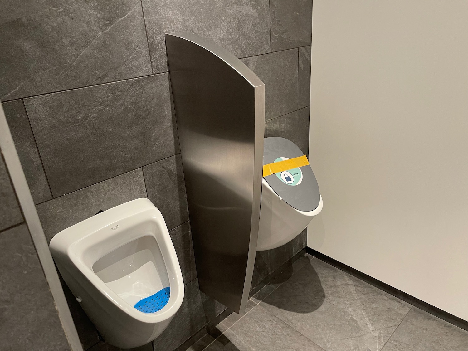 a urinal with a cartoon face on it