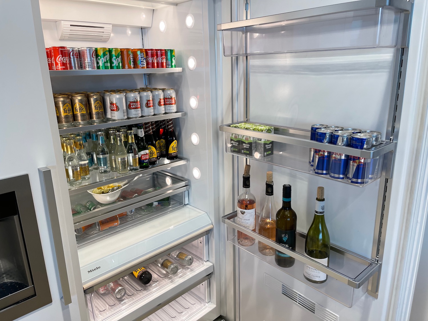 a refrigerator with drinks and cans