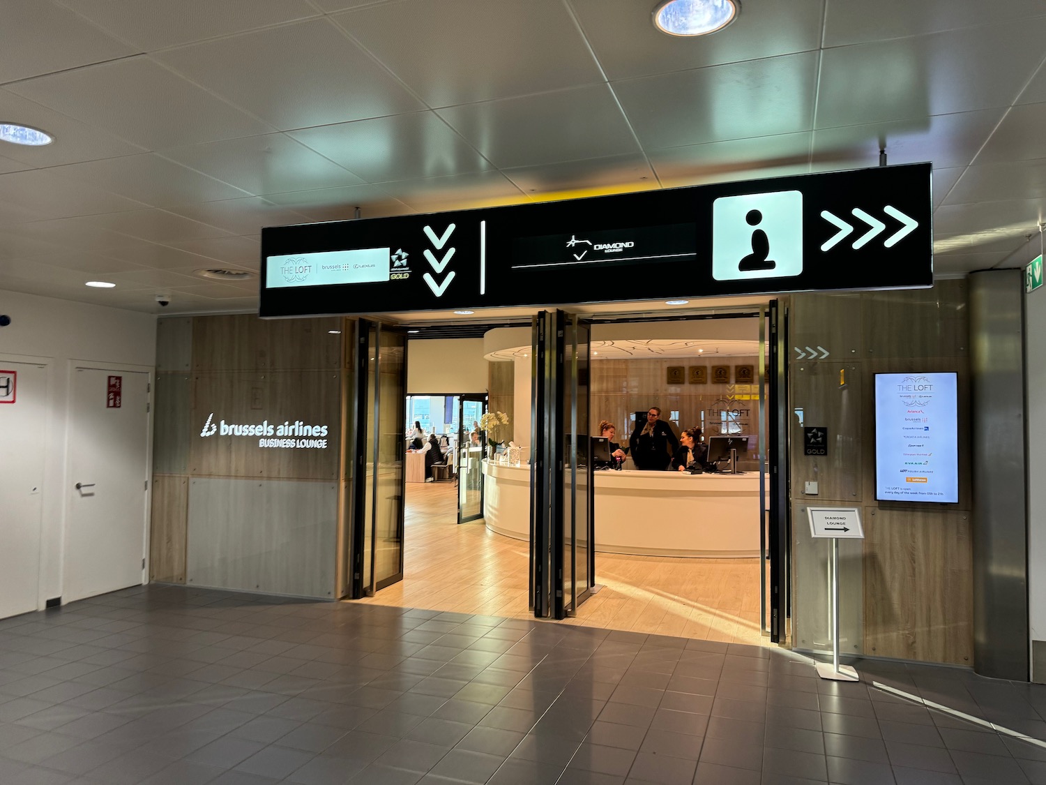 a building with a sign and a reception desk