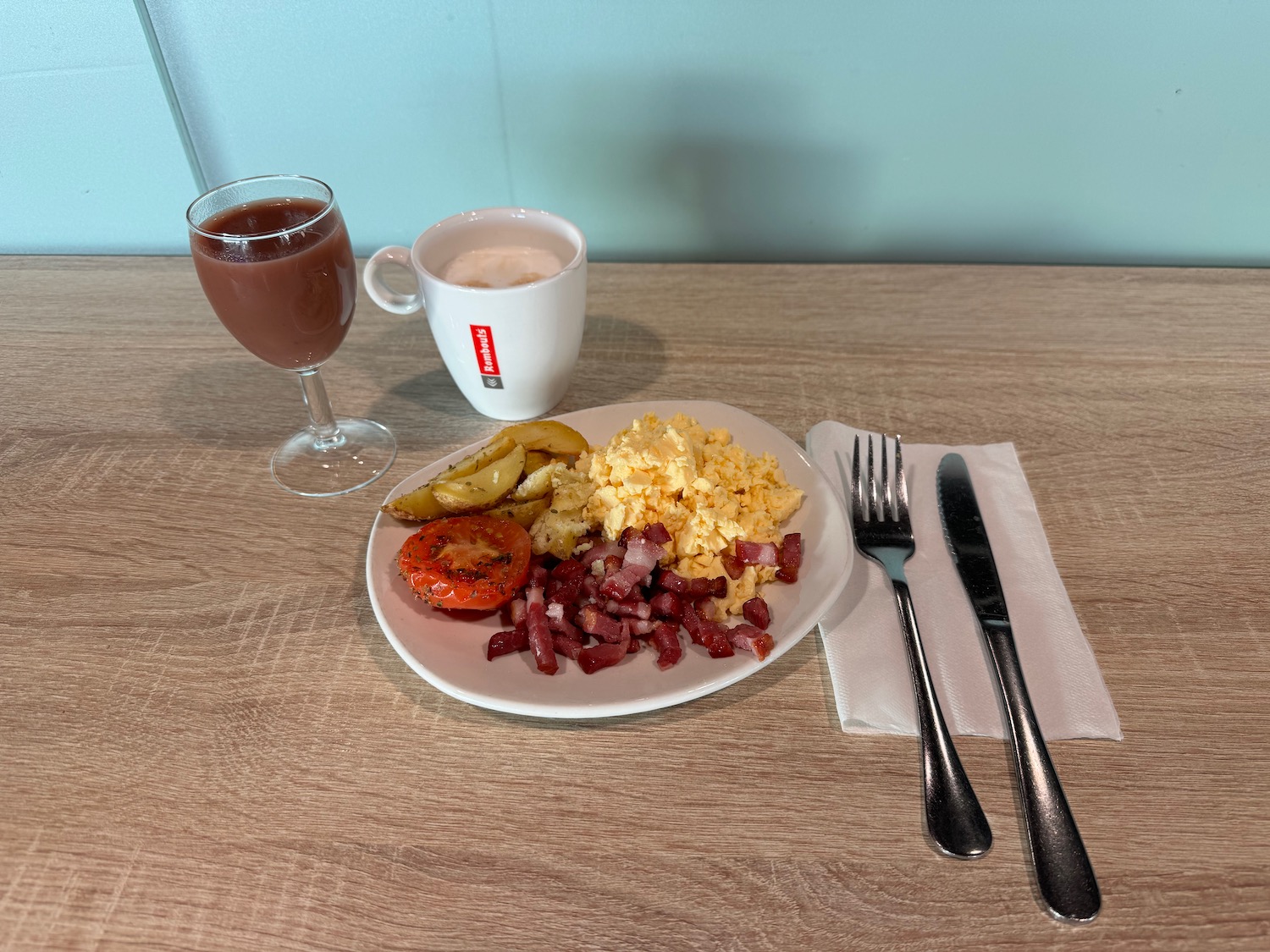 a plate of food and a drink on a table