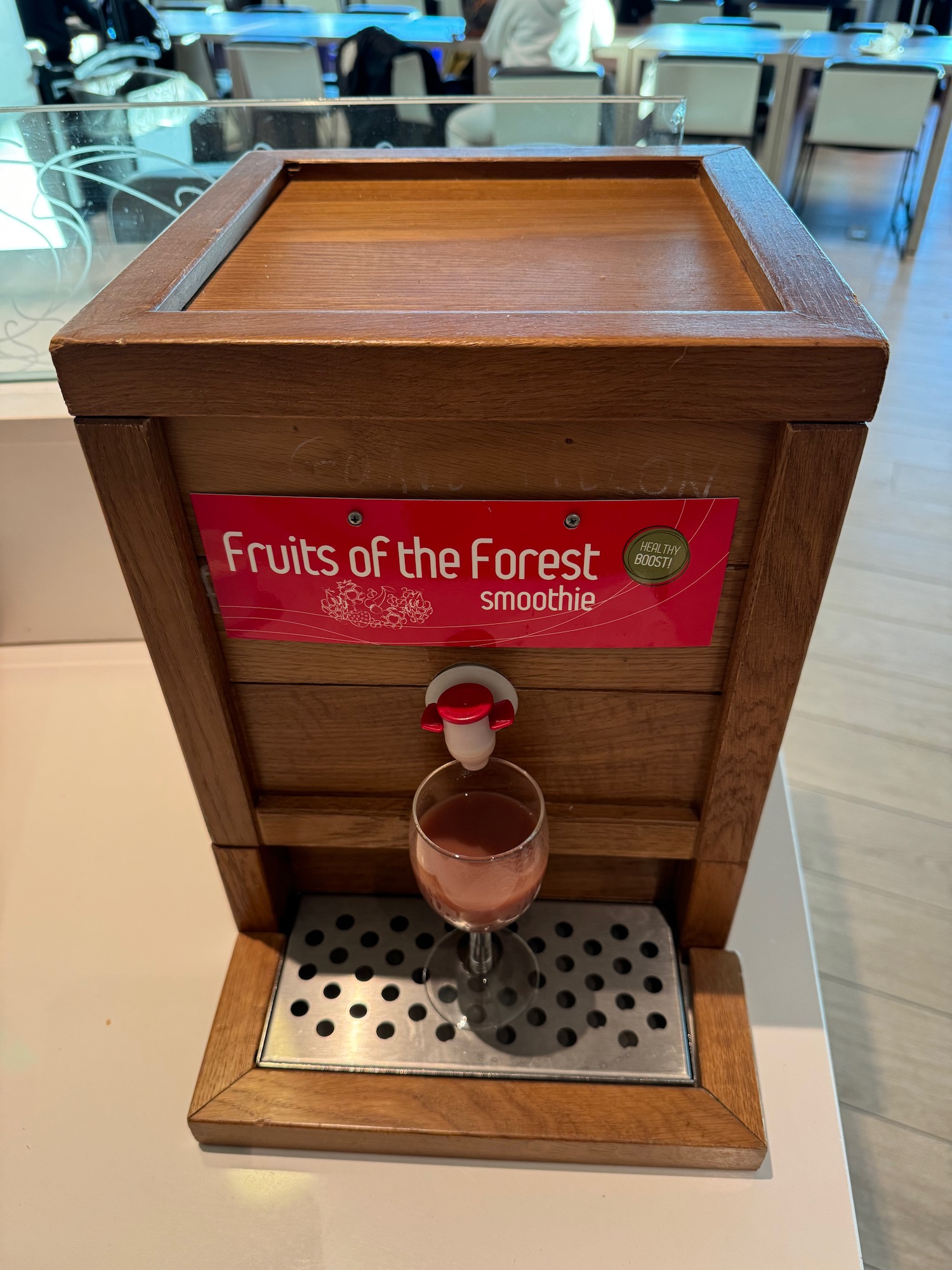 a wooden box with a drink in it