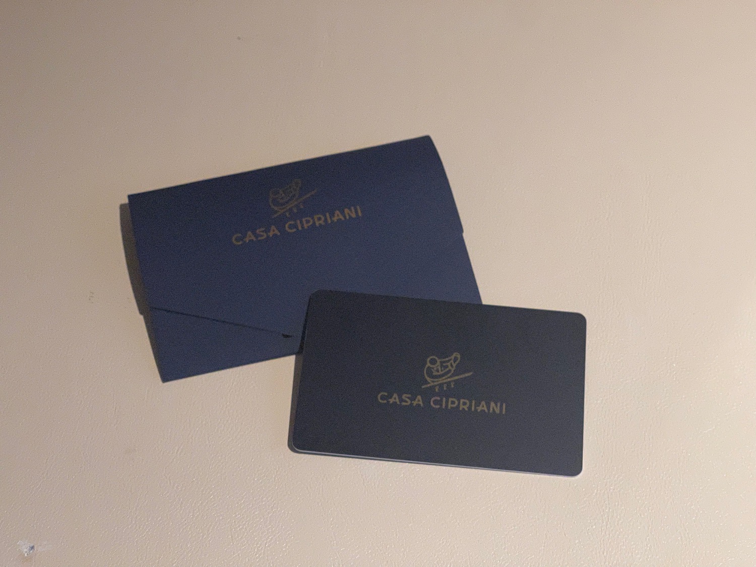 a blue envelopes with gold text on them