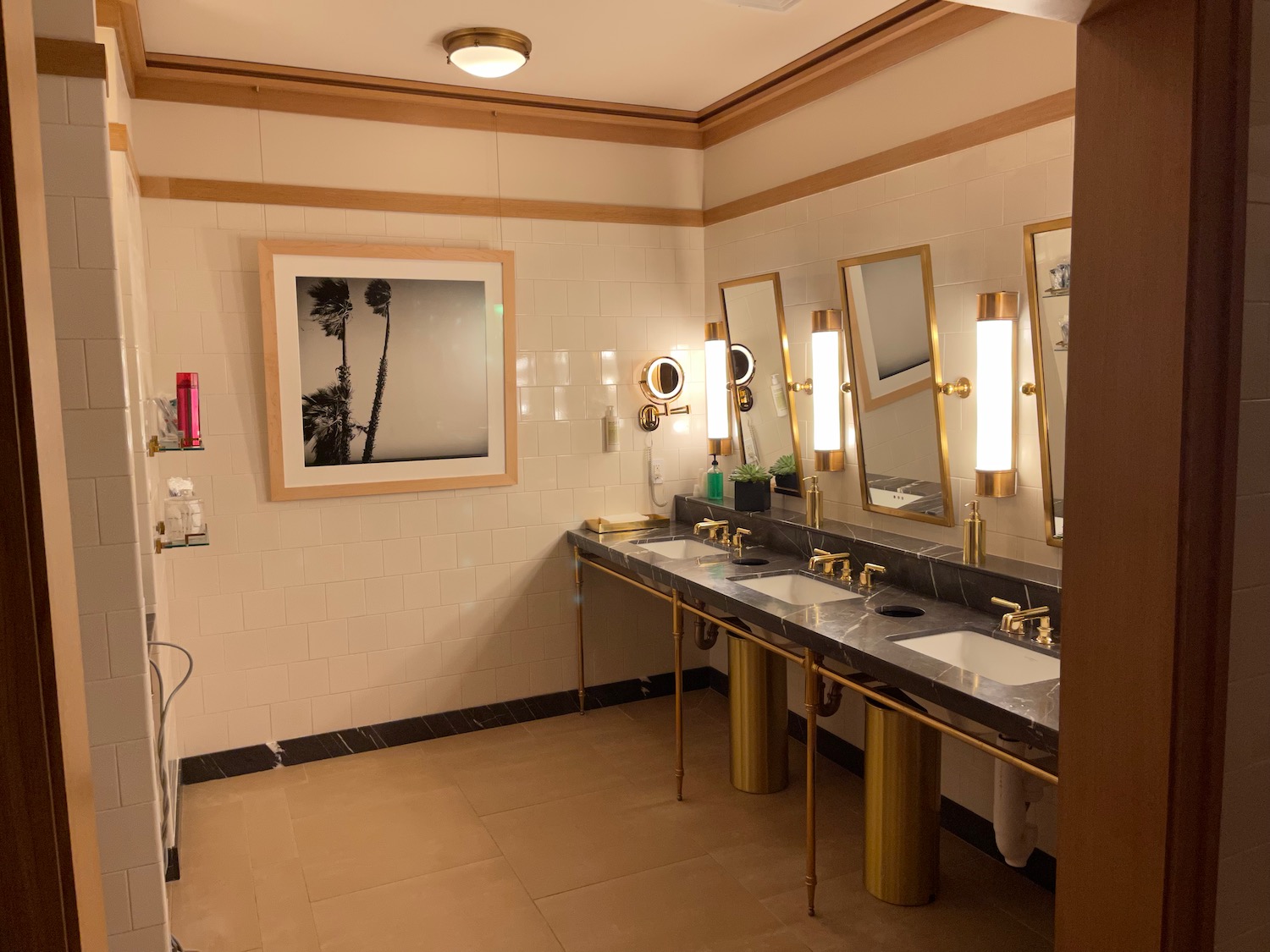 a bathroom with sinks and mirrors