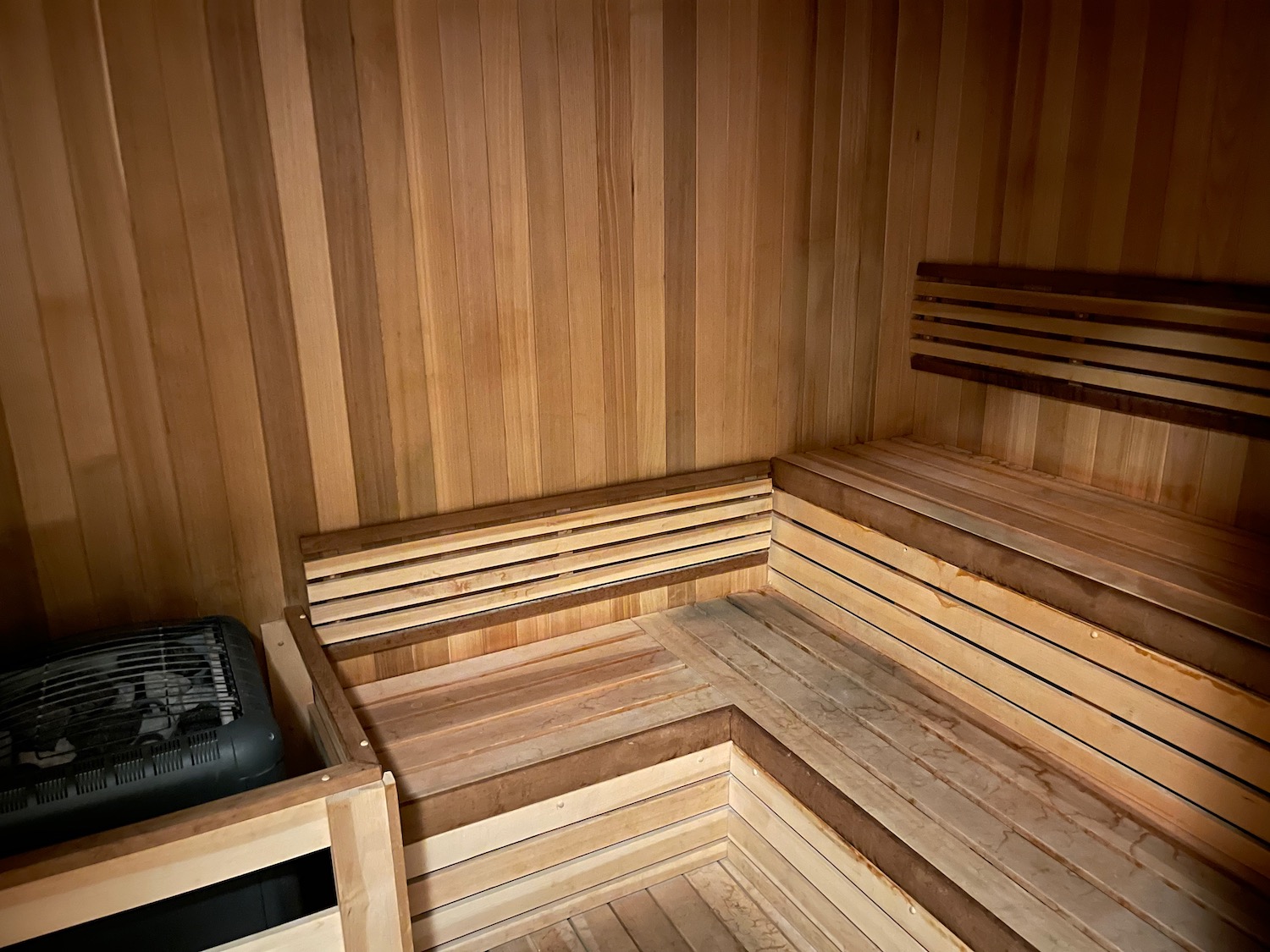 a wooden sauna with a heater