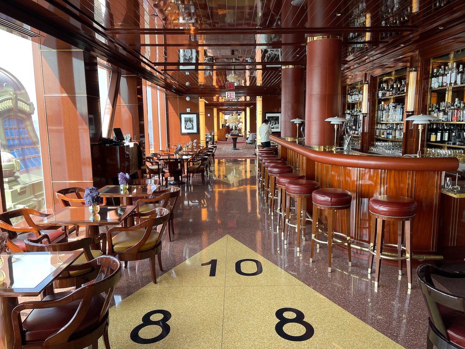 a bar with tables and chairs