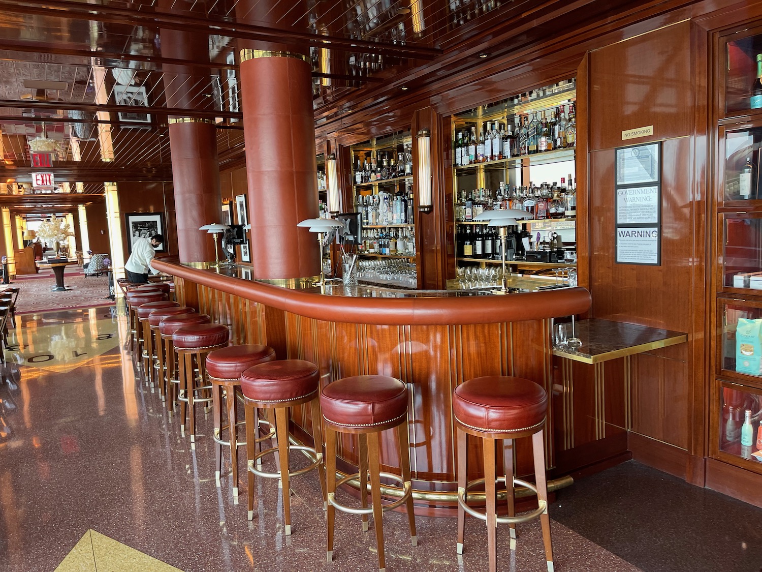 a bar with stools and a counter