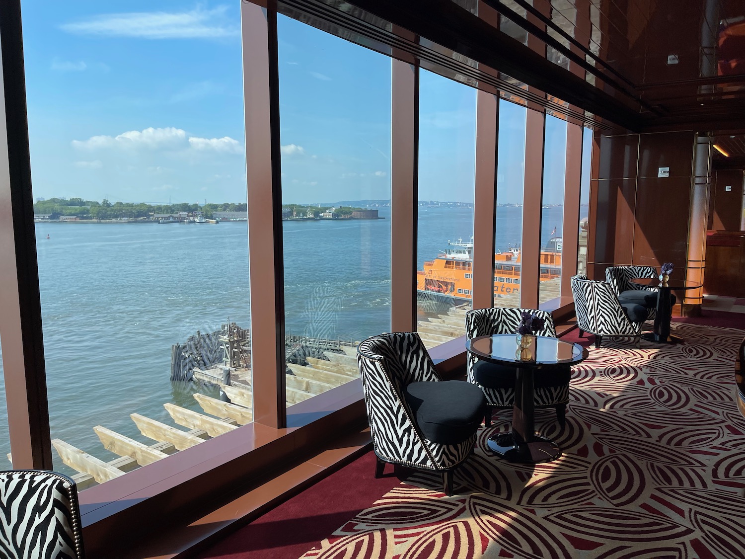 a room with a view of the water and a boat