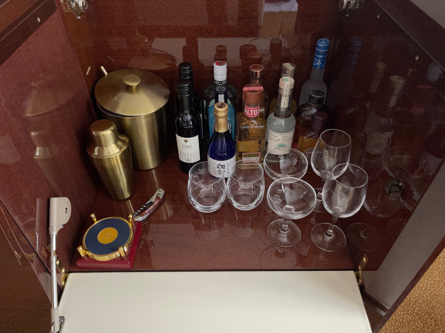 a group of bottles and glasses on a counter