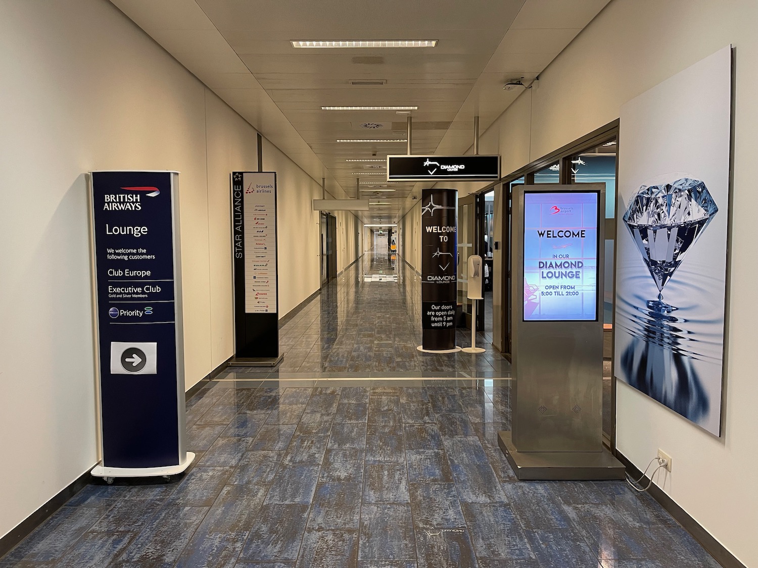 a hallway with signs and a sign on the wall