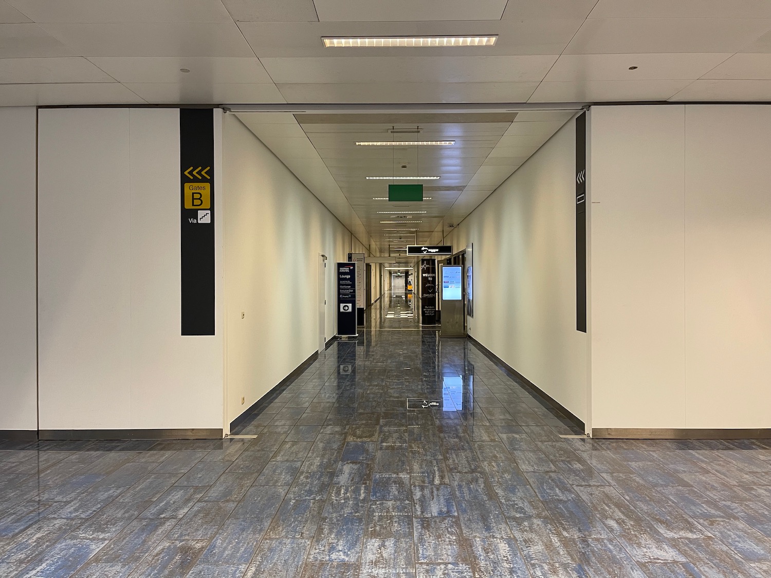 a hallway with a tile floor