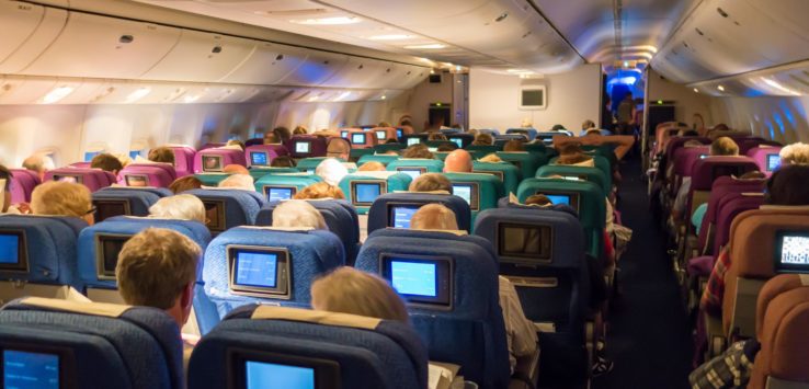 an airplane with many seats and a monitor