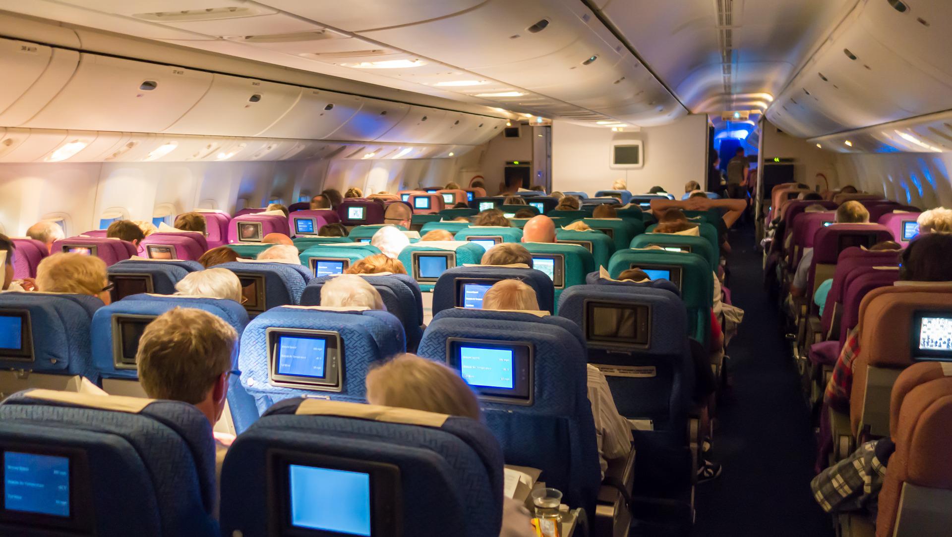 an airplane with many seats and a monitor