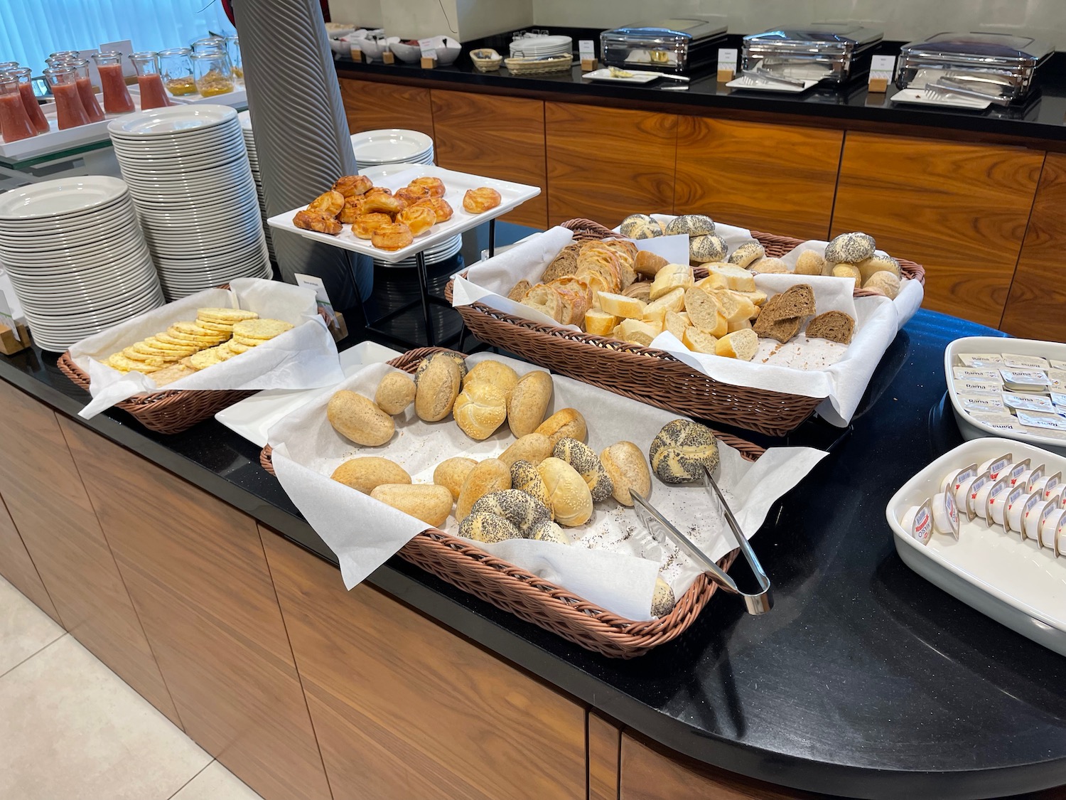 a group of baskets of bread and pastries