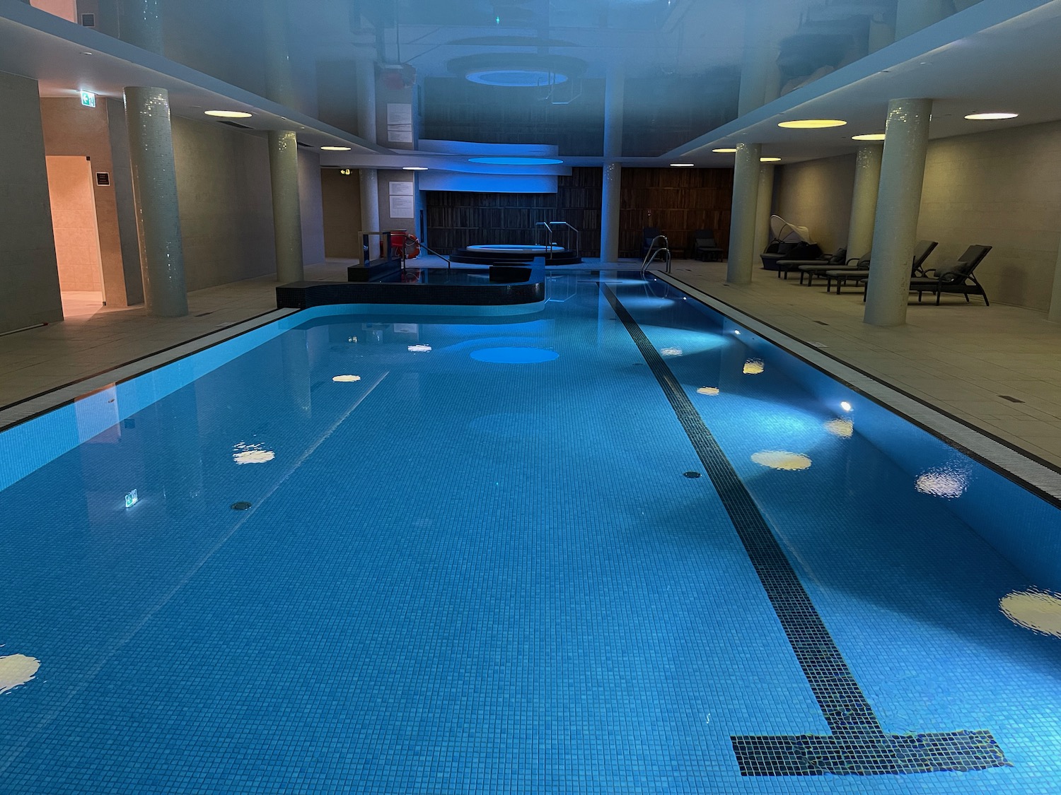 a indoor swimming pool with a large pool