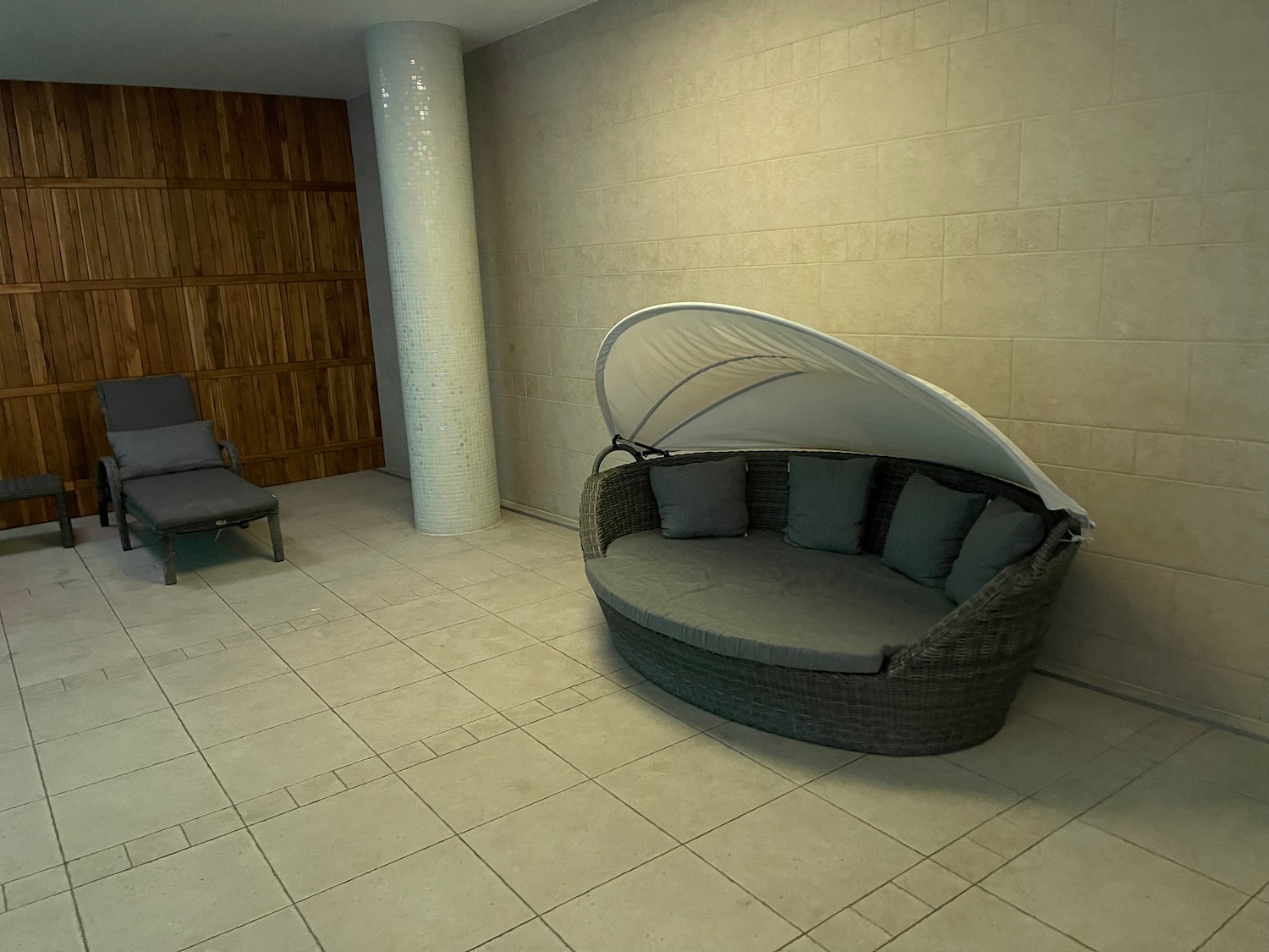 a couch with a canopy in a room