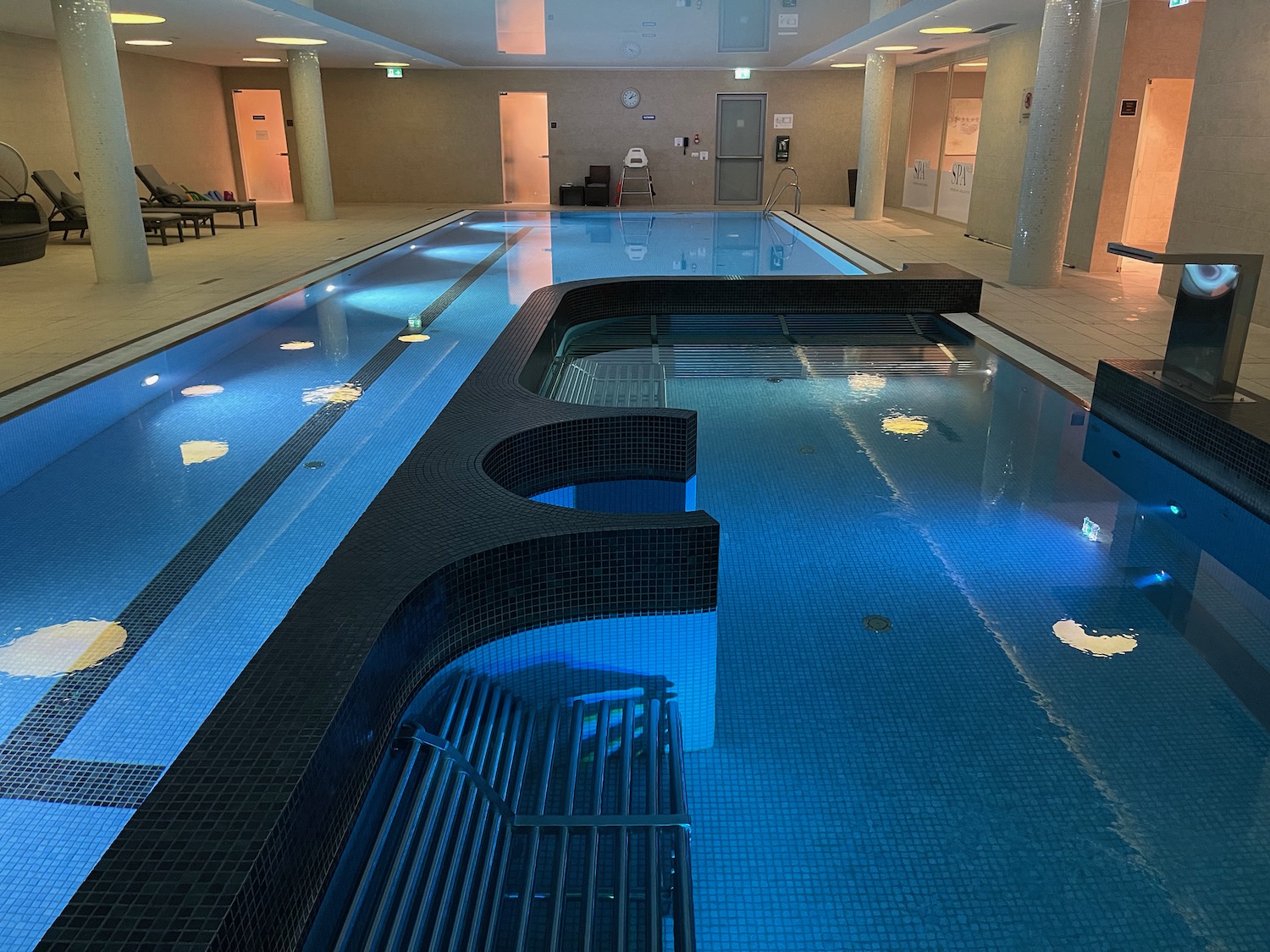 a indoor pool with blue lights