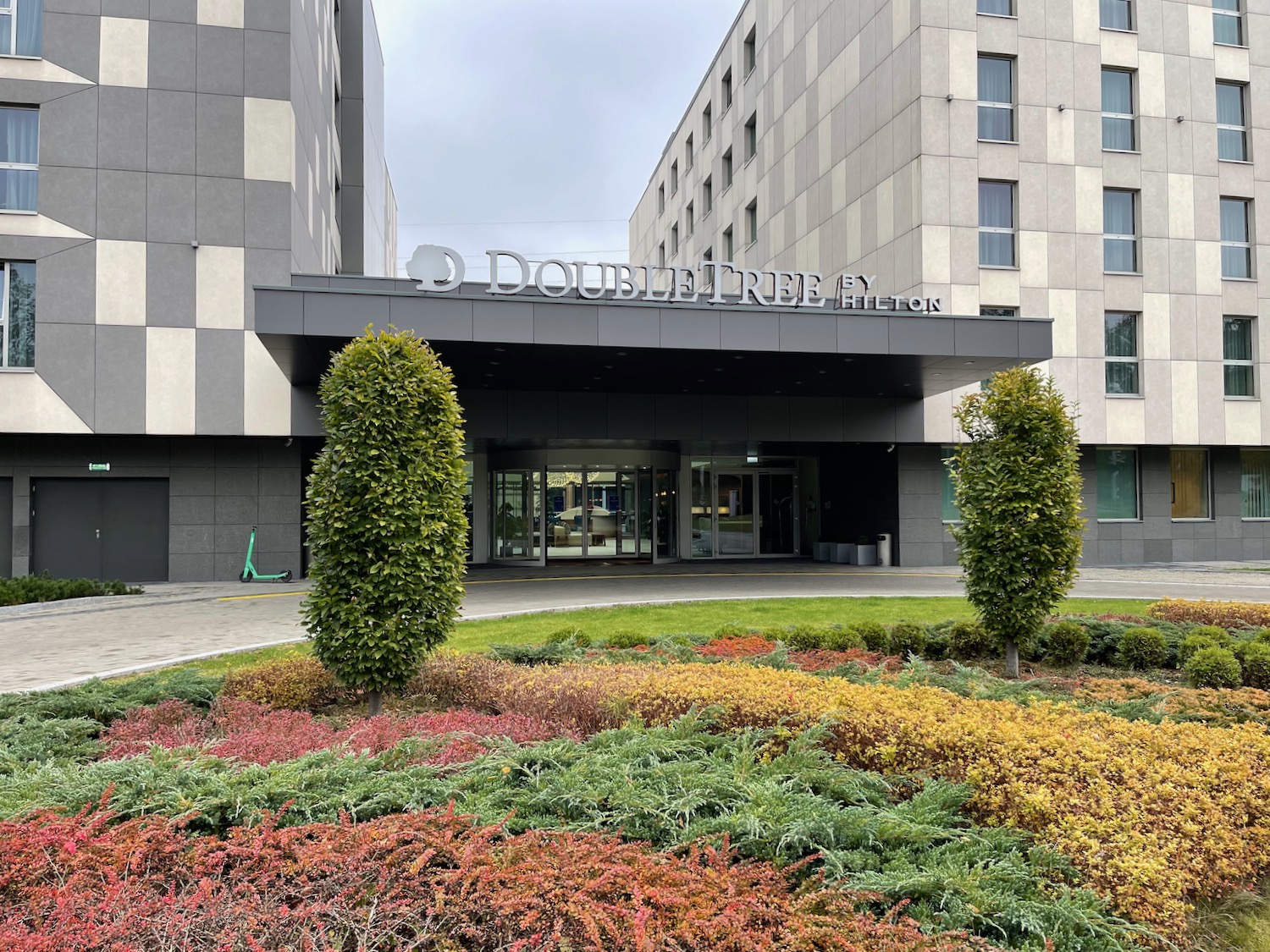 a building with a lot of plants and trees