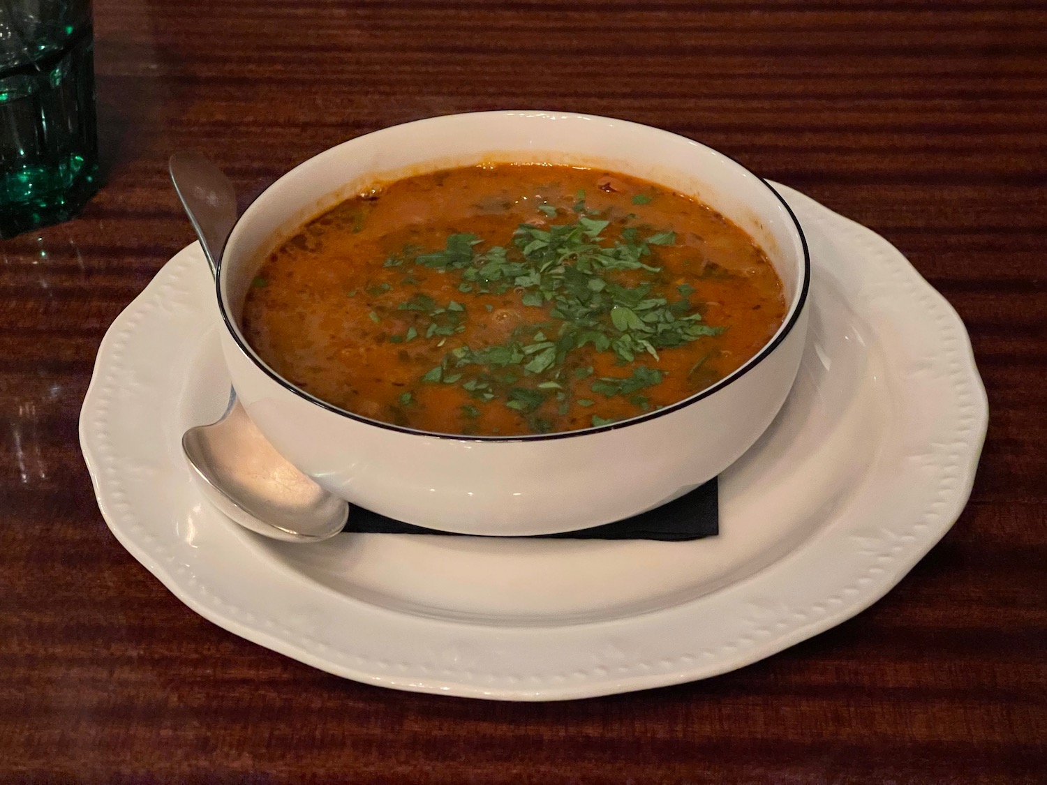 a bowl of soup on a plate