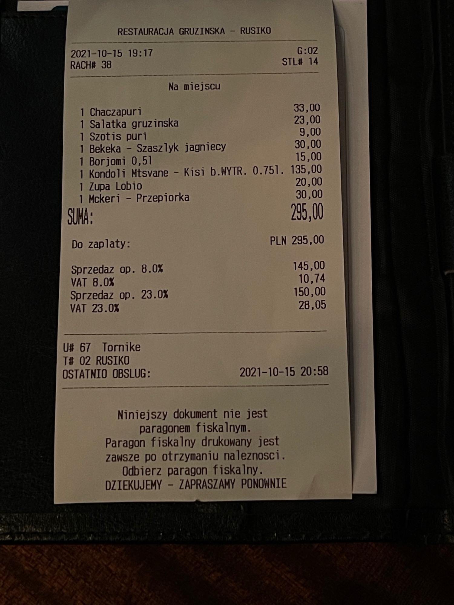 a receipt on a black surface