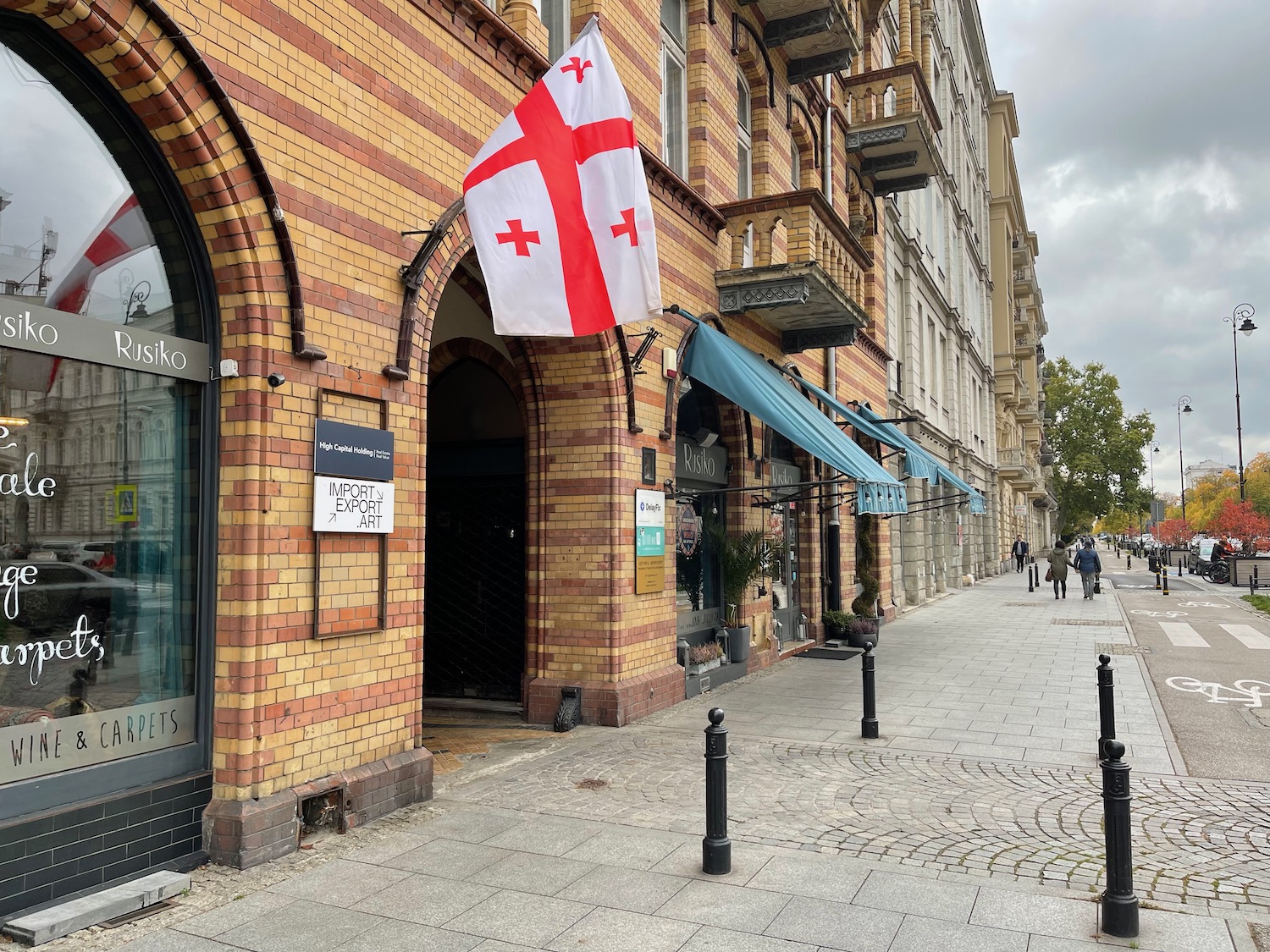 a brick building with a flag on the side