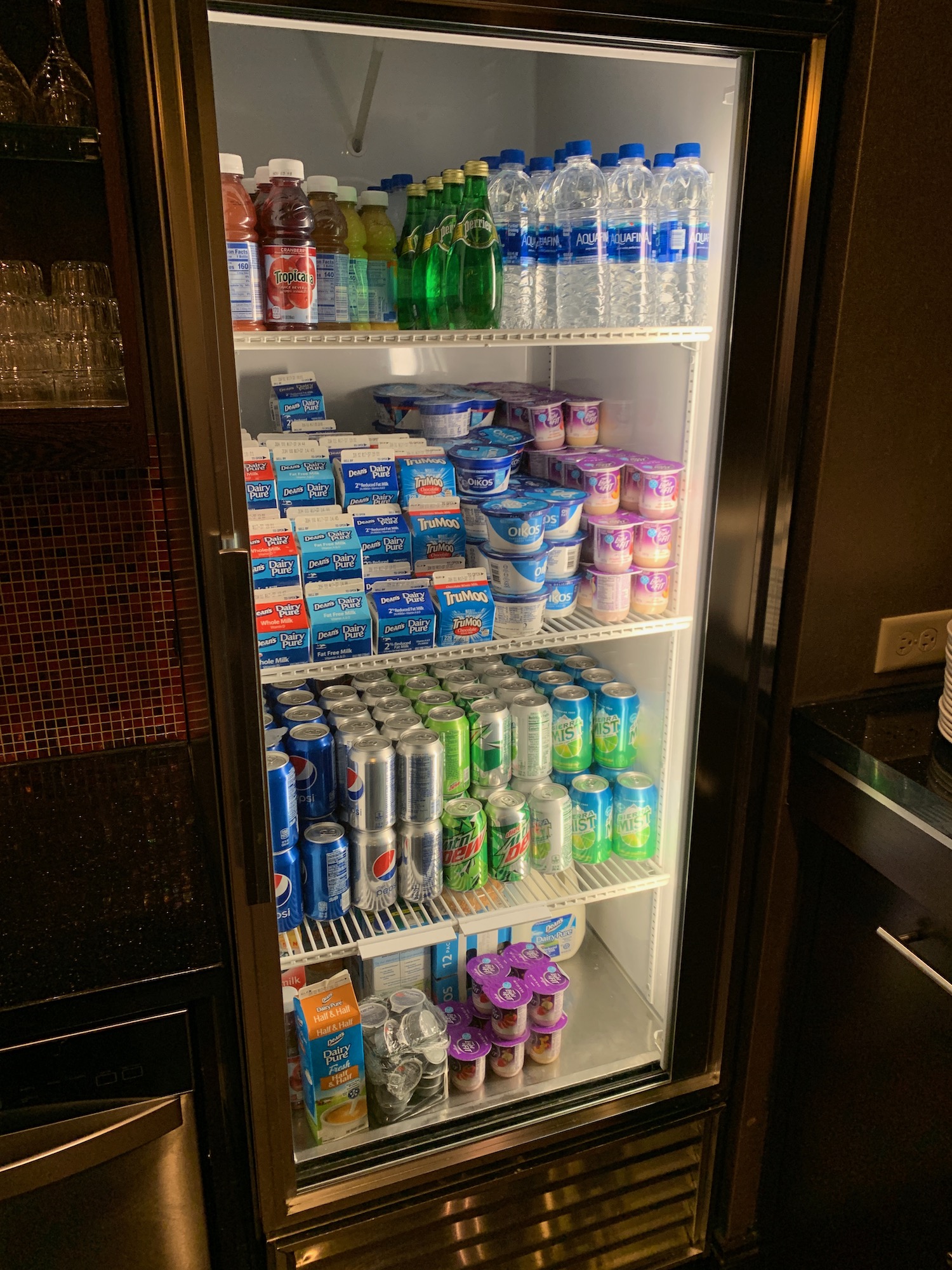 a refrigerator full of drinks and beverages