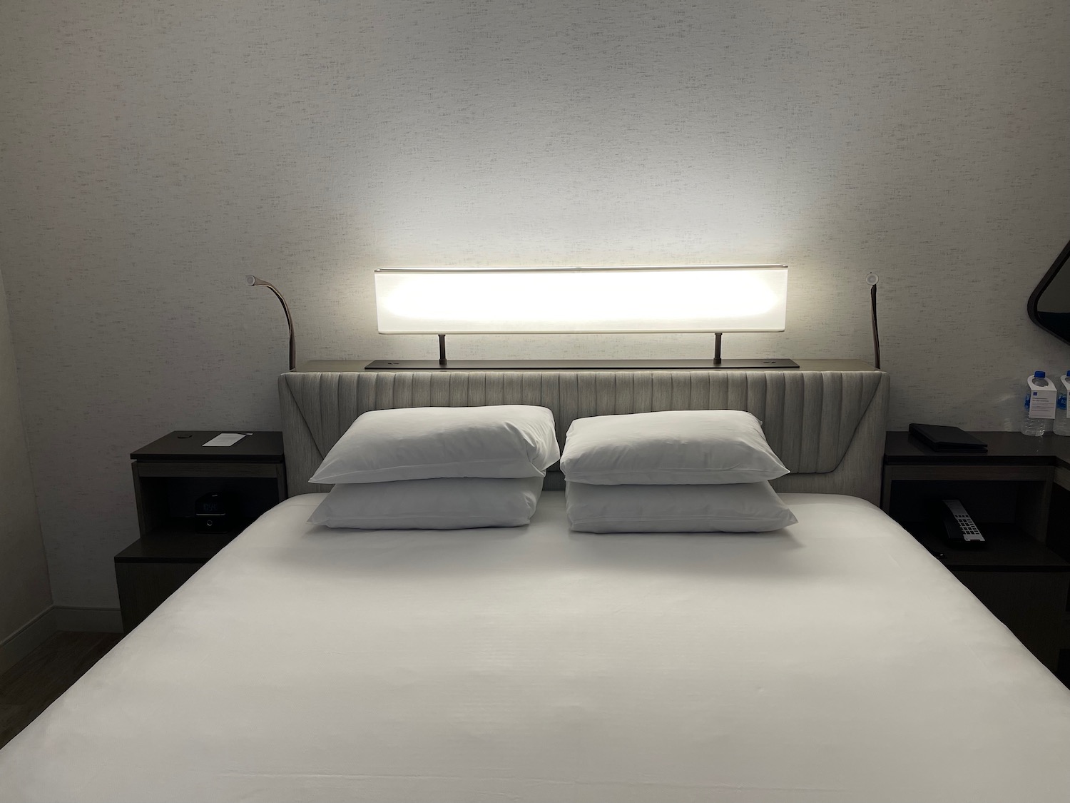 a bed with a light above it