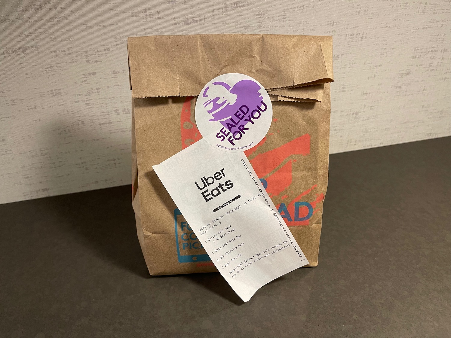 a brown paper bag with a white label