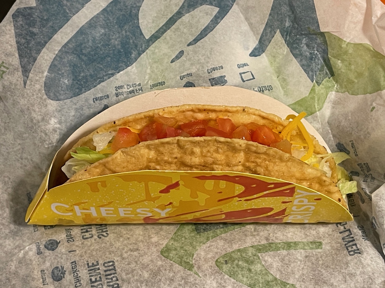 a taco in a paper wrapper