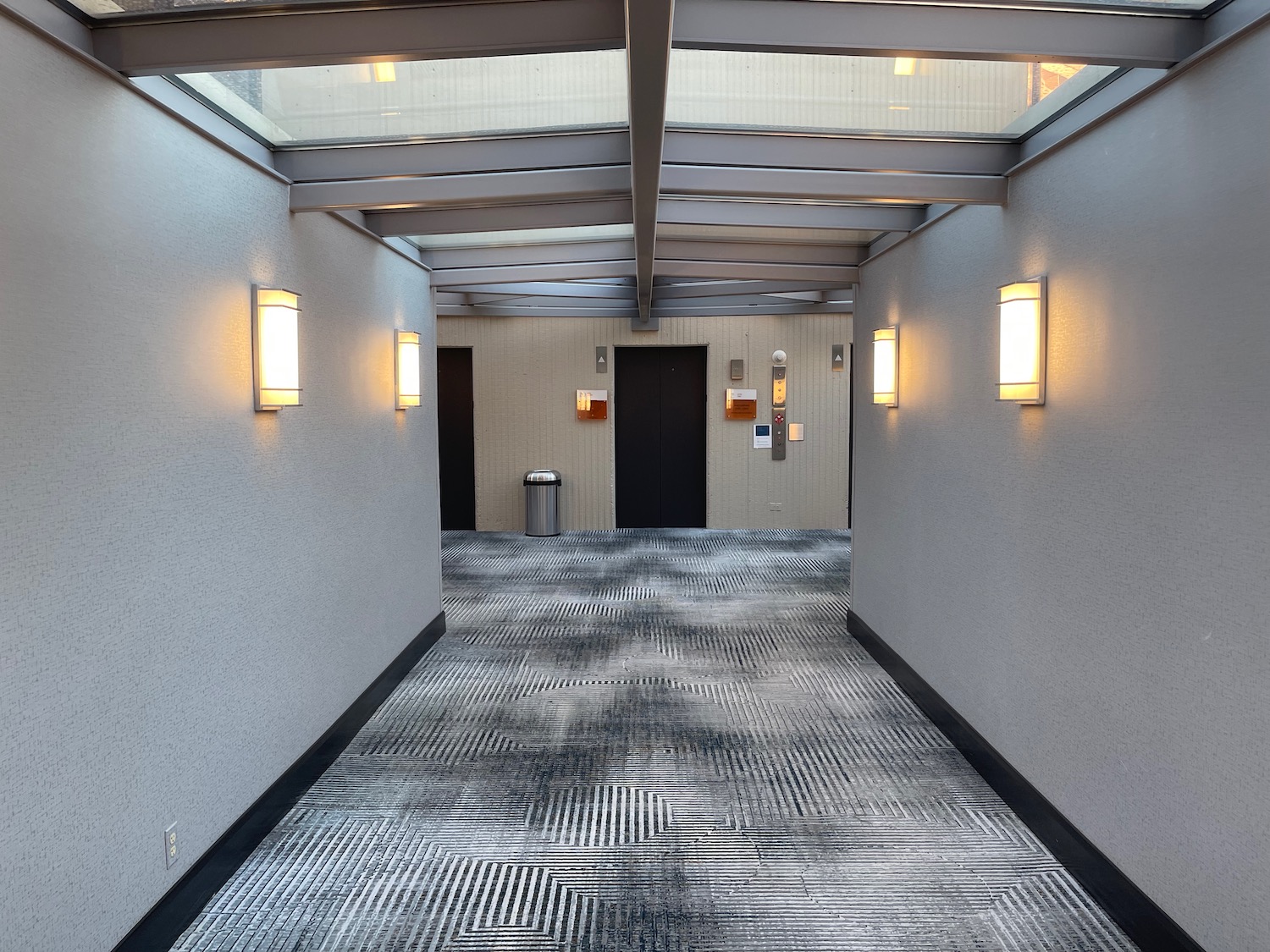 a hallway with a glass roof